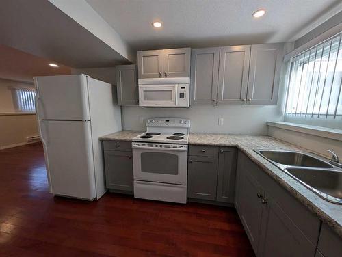 193 Seven Persons Drive Sw, Medicine Hat, AB - Indoor Photo Showing Kitchen With Double Sink