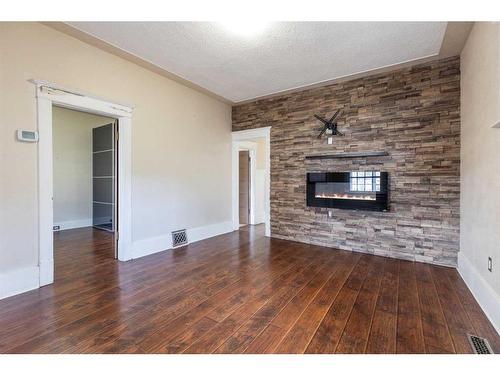 825 8 Street Se, Medicine Hat, AB - Indoor Photo Showing Living Room With Fireplace