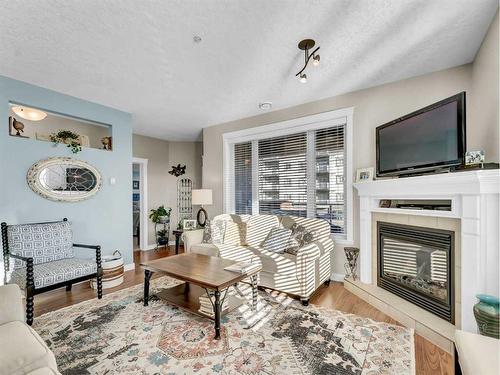 108-85 Terrace Drive Ne, Medicine Hat, AB - Indoor Photo Showing Living Room With Fireplace