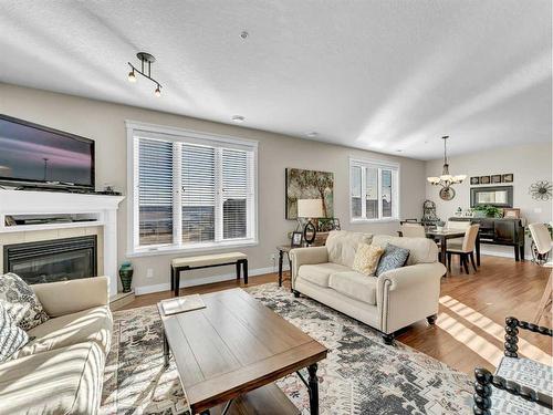 108-85 Terrace Drive Ne, Medicine Hat, AB - Indoor Photo Showing Living Room With Fireplace