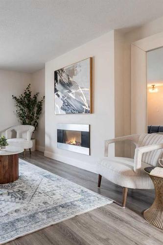 655 8 Street Sw, Medicine Hat, AB - Indoor Photo Showing Living Room With Fireplace