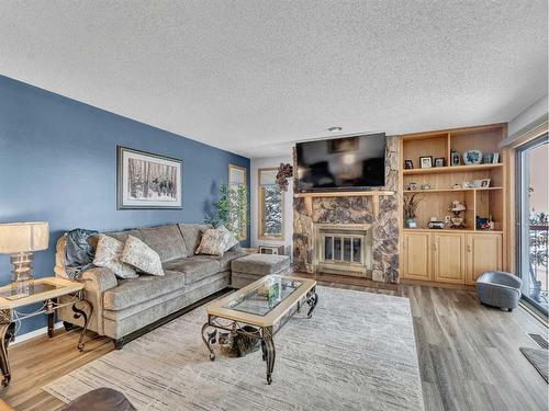 15-1165 16 Street Ne, Medicine Hat, AB - Indoor Photo Showing Living Room With Fireplace