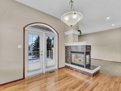 2 Vintage Meadows Court Se, Medicine Hat, AB - Indoor Photo Showing Living Room With Fireplace