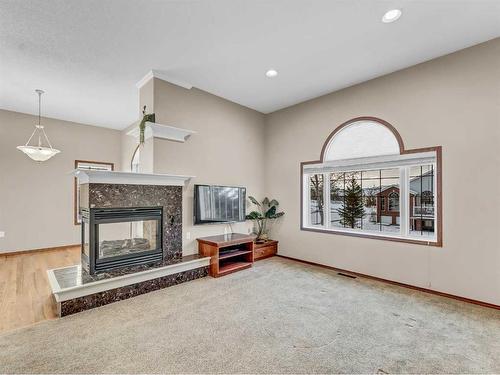 2 Vintage Meadows Court Se, Medicine Hat, AB - Indoor Photo Showing Living Room With Fireplace