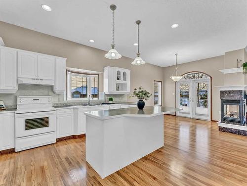 2 Vintage Meadows Court Se, Medicine Hat, AB - Indoor Photo Showing Kitchen With Fireplace