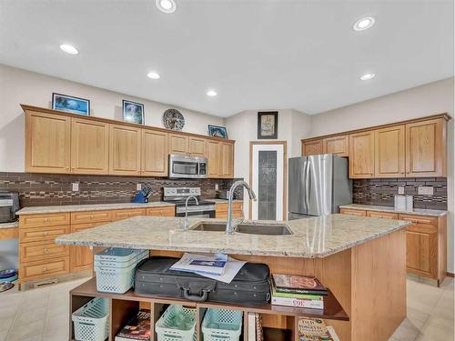 15 Turner Green Se, Medicine Hat, AB - Indoor Photo Showing Kitchen With Stainless Steel Kitchen