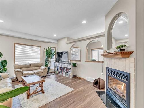 15 Turner Green Se, Medicine Hat, AB - Indoor Photo Showing Living Room With Fireplace