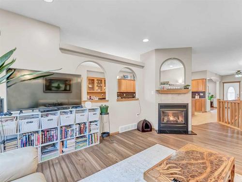 15 Turner Green Se, Medicine Hat, AB - Indoor Photo Showing Living Room With Fireplace