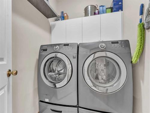 15 Turner Green Se, Medicine Hat, AB - Indoor Photo Showing Laundry Room