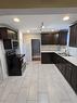 111 2 Street Ne, Medicine Hat, AB  - Indoor Photo Showing Kitchen With Double Sink 