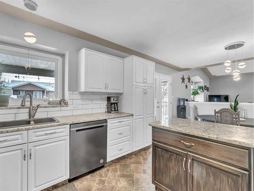 15 Storrs Crescent Se, Medicine Hat, AB - Indoor Photo Showing Kitchen With Double Sink