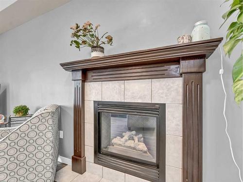 15 Storrs Crescent Se, Medicine Hat, AB - Indoor Photo Showing Other Room With Fireplace