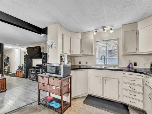 327 1 Street Ne, Redcliff, AB - Indoor Photo Showing Kitchen With Double Sink