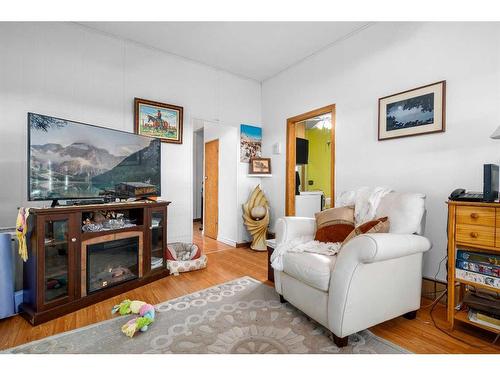 20 Railway Ave E, Schuler, AB - Indoor Photo Showing Living Room With Fireplace