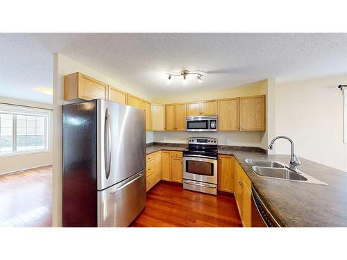 38 Northlands Lane Ne, Medicine Hat, AB - Indoor Photo Showing Kitchen With Double Sink