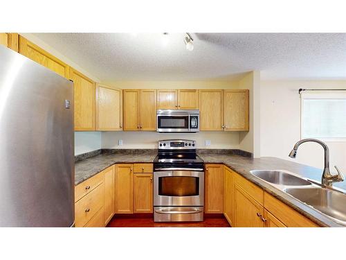 38 Northlands Lane Ne, Medicine Hat, AB - Indoor Photo Showing Kitchen With Double Sink