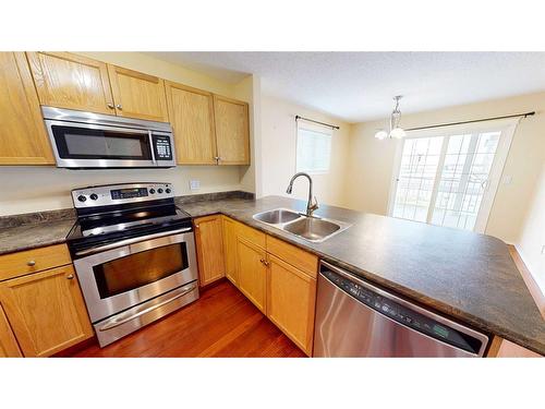 38 Northlands Lane Ne, Medicine Hat, AB - Indoor Photo Showing Kitchen With Double Sink