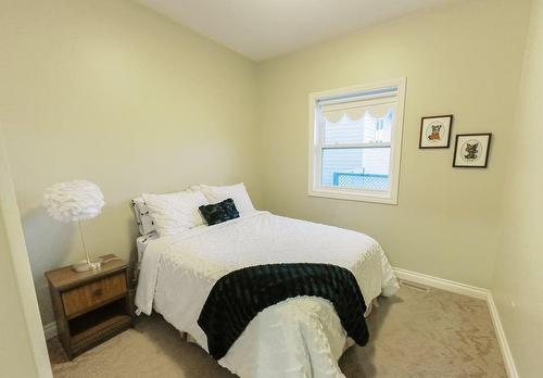 6002 52 Avenue, Stettler, AB - Indoor Photo Showing Bedroom