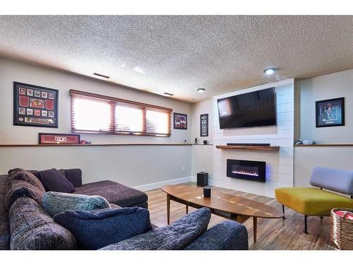 8 Rideau Close Se, Medicine Hat, AB - Indoor Photo Showing Living Room With Fireplace