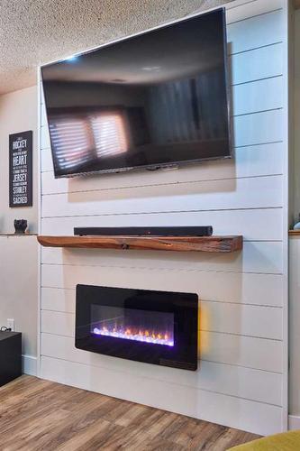 8 Rideau Close Se, Medicine Hat, AB - Indoor Photo Showing Living Room With Fireplace