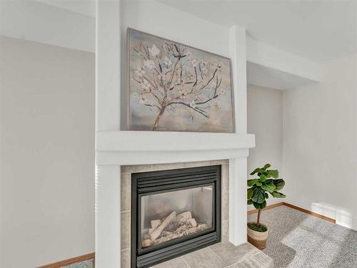 305 Park Meadows Lane Se, Medicine Hat, AB - Indoor Photo Showing Living Room With Fireplace