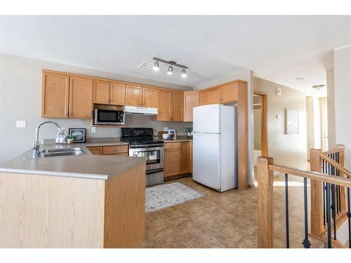 73 Sunrise Way Sw, Medicine Hat, AB - Indoor Photo Showing Kitchen With Double Sink