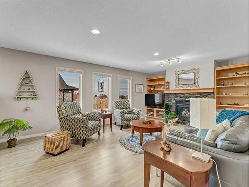 8 Sunrise Bay Sw, Medicine Hat, AB - Indoor Photo Showing Living Room With Fireplace