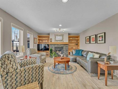 8 Sunrise Bay Sw, Medicine Hat, AB - Indoor Photo Showing Living Room With Fireplace