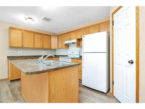 3-102 Sunwood Crescent Sw, Medicine Hat, AB - Indoor Photo Showing Kitchen With Double Sink