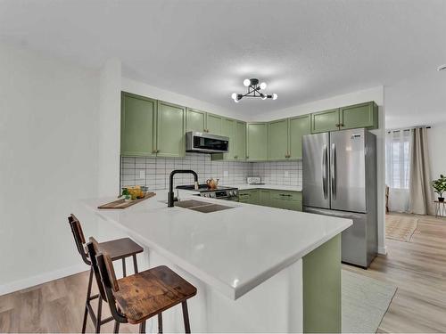 60 Northlands Lane Ne, Medicine Hat, AB - Indoor Photo Showing Kitchen With Double Sink With Upgraded Kitchen