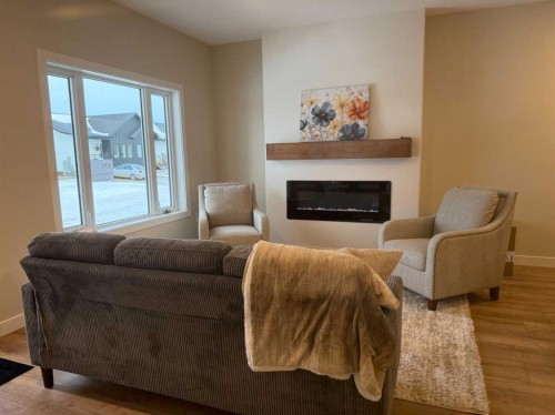 171 Parkview Crescent West, Bow Island, AB - Indoor Photo Showing Living Room With Fireplace
