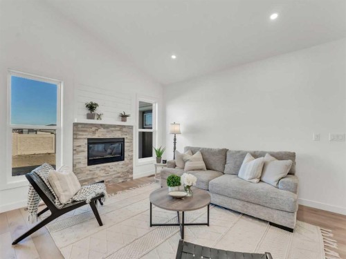 32 Somerside Way Se, Medicine Hat, AB - Indoor Photo Showing Living Room With Fireplace