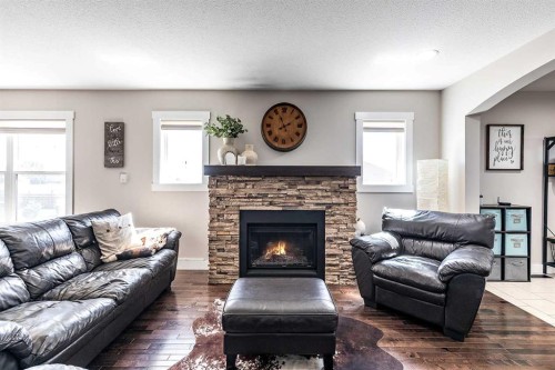 13029A Range Road 50, Rural Cypress County, AB - Indoor Photo Showing Living Room With Fireplace