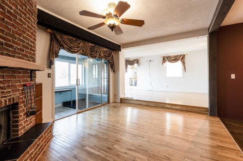 176 1 Street Sw, Medicine Hat, AB - Indoor Photo Showing Other Room With Fireplace