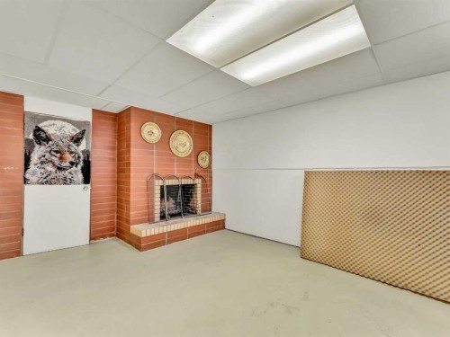 1702 15 Avenue Se, Medicine Hat, AB - Indoor Photo Showing Other Room With Fireplace
