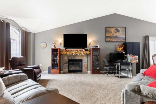404 Jesmond Place Sw, Redcliff, AB - Indoor Photo Showing Living Room With Fireplace