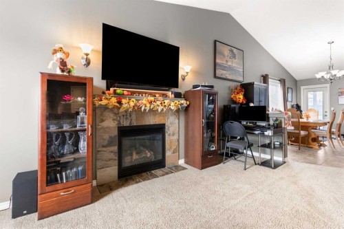 404 Jesmond Place Sw, Redcliff, AB - Indoor Photo Showing Living Room With Fireplace