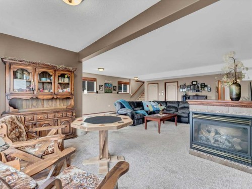 264 Sierra Road Sw, Medicine Hat, AB - Indoor Photo Showing Living Room With Fireplace