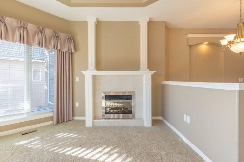 108 River Ridge Drive Nw, Medicine Hat, AB - Indoor Photo Showing Living Room With Fireplace