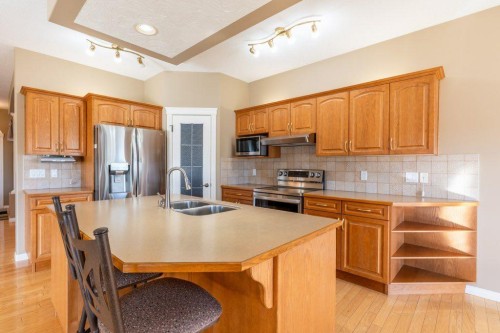 108 River Ridge Drive Nw, Medicine Hat, AB - Indoor Photo Showing Kitchen With Double Sink