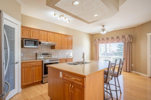 108 River Ridge Drive Nw, Medicine Hat, AB - Indoor Photo Showing Kitchen With Double Sink