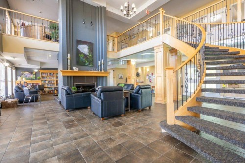 108 River Ridge Drive Nw, Medicine Hat, AB - Indoor Photo Showing Other Room With Fireplace