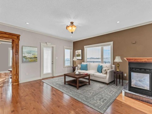 150 Desert Blume Crescent, Desert Blume, AB - Indoor Photo Showing Living Room With Fireplace