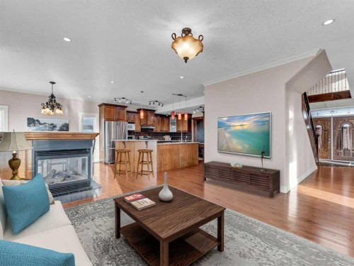 150 Desert Blume Crescent, Desert Blume, AB - Indoor Photo Showing Living Room With Fireplace