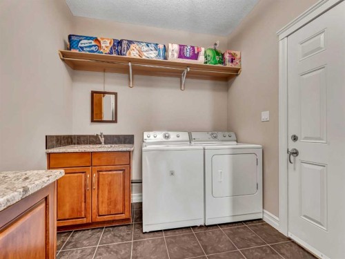 150 Desert Blume Crescent, Desert Blume, AB - Indoor Photo Showing Laundry Room