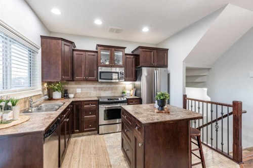 129 Ranchman Crescent Ne, Medicine Hat, AB - Indoor Photo Showing Kitchen With Stainless Steel Kitchen With Double Sink
