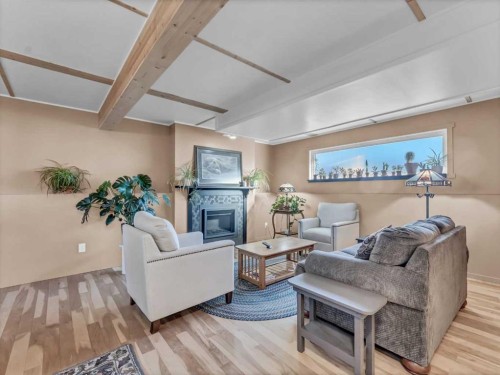 106 Rossland Road Se, Medicine Hat, AB - Indoor Photo Showing Living Room With Fireplace