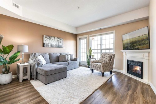 329-201 River Ridge Drive Nw, Medicine Hat, AB - Indoor Photo Showing Living Room With Fireplace