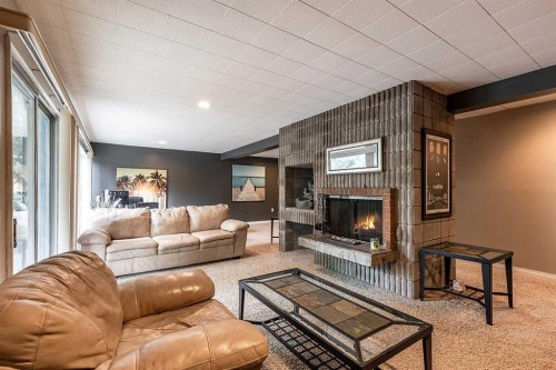 22 Chinook Drive Sw, Medicine Hat, AB - Indoor Photo Showing Living Room With Fireplace
