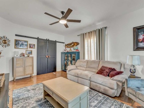 27 4 Street Sw, Medicine Hat, AB - Indoor Photo Showing Living Room With Fireplace